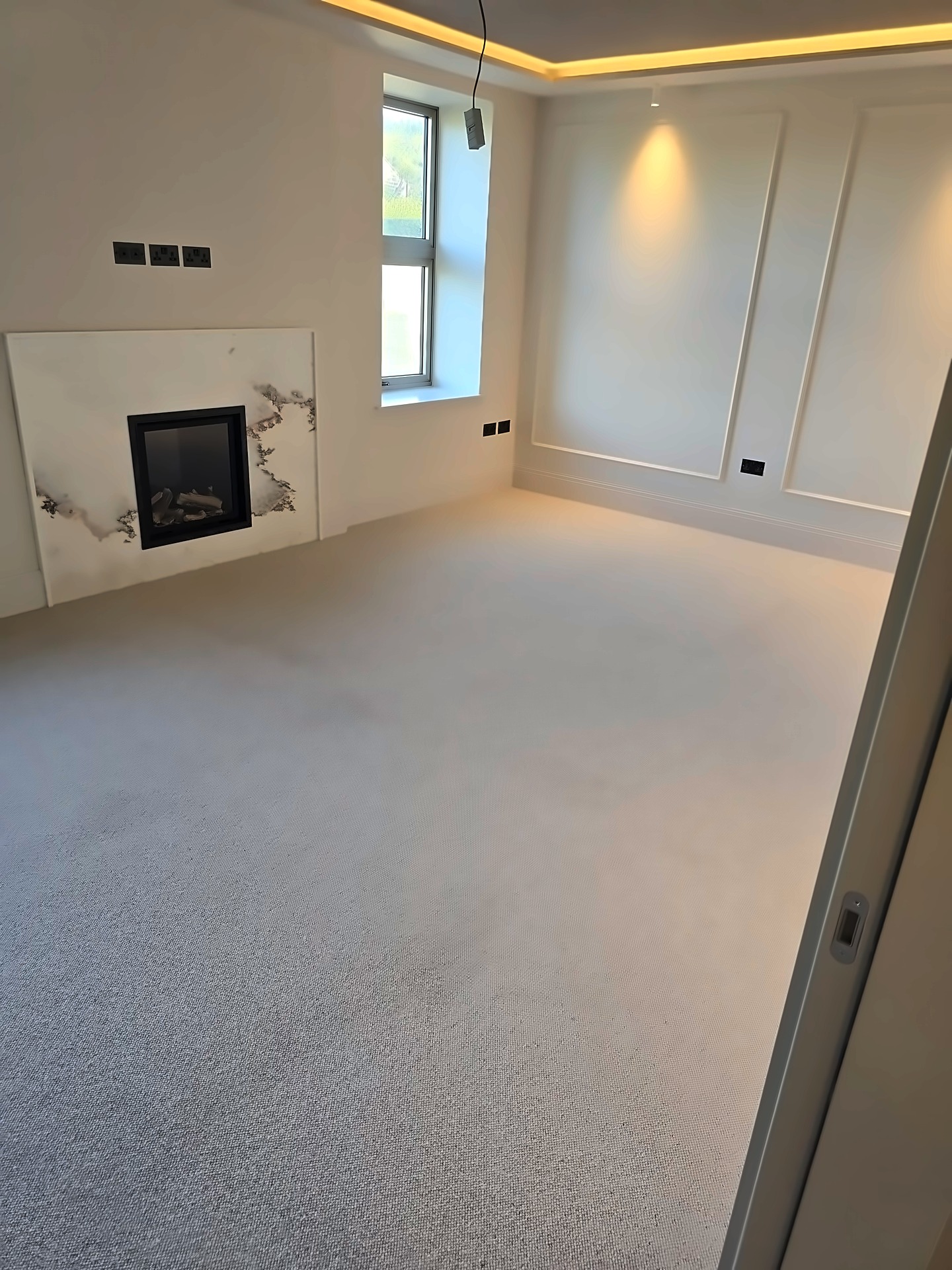End of tenancy clean — carpeted room with log burner, professionally deep cleaned