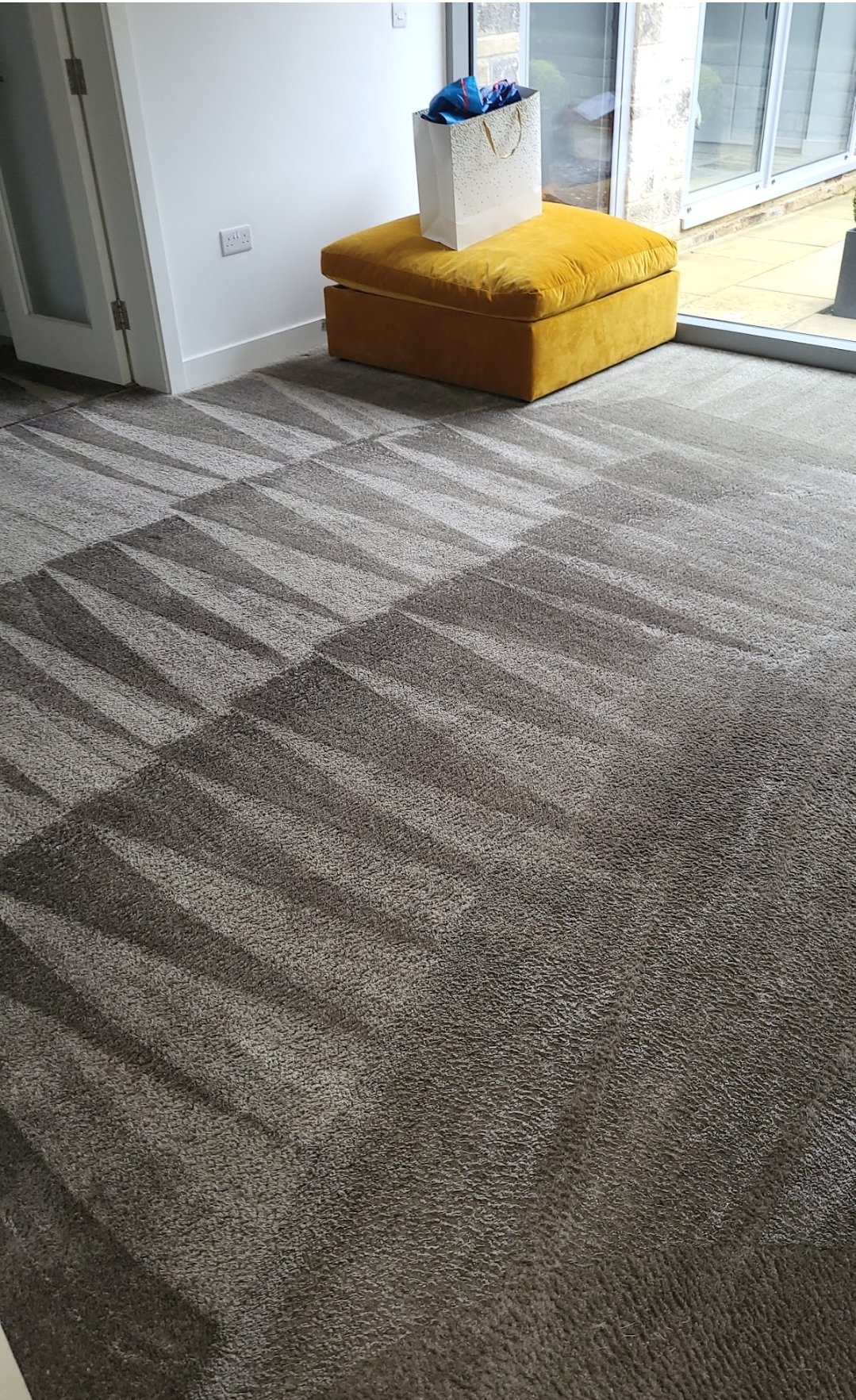 Stripe-pattern grey carpet after professional cleaning in Guiseley home