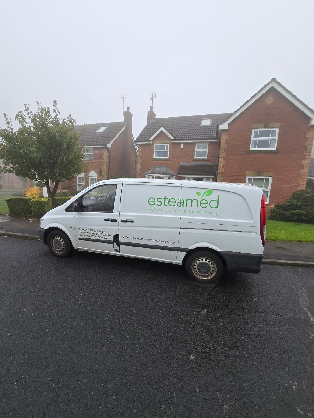 Esteamed cleaning van parked on a residential street in Harrogate
