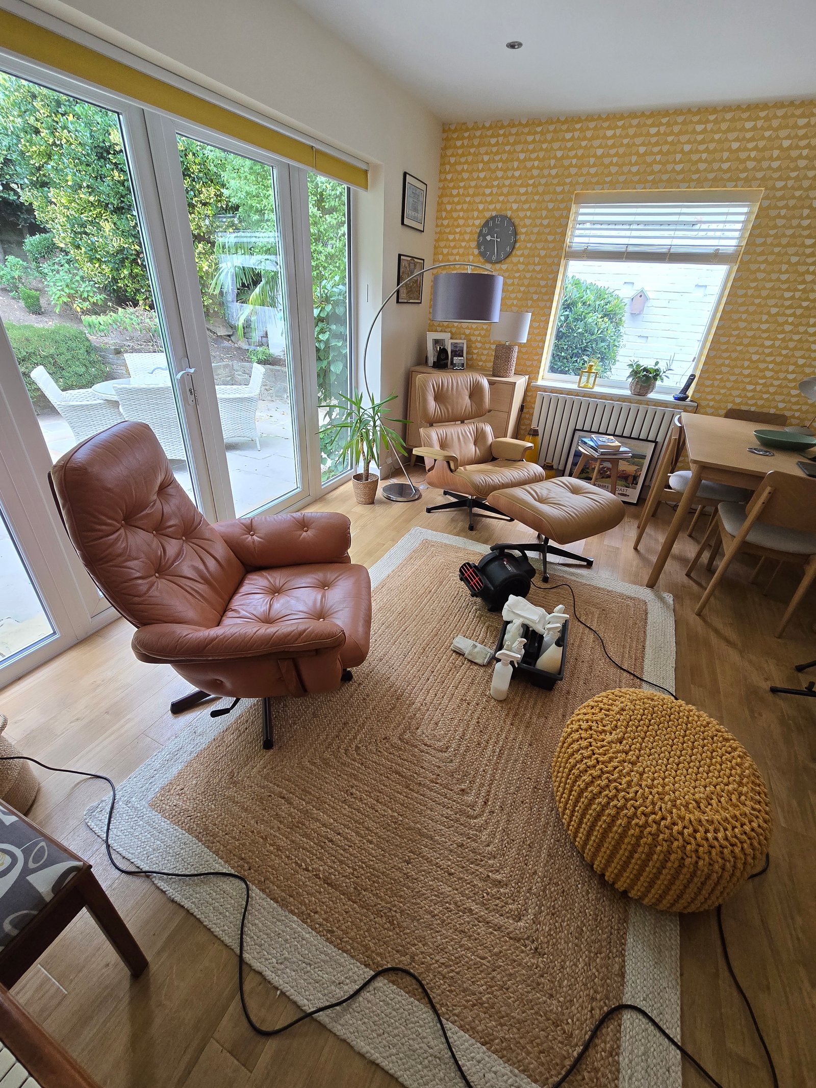 Leather cleaning in progress — equipment and products ready for treatment